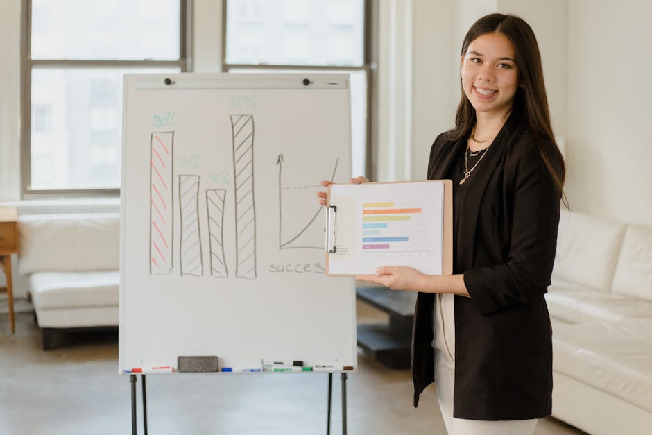Woman presenting business data on clipboard with success graph in an office.